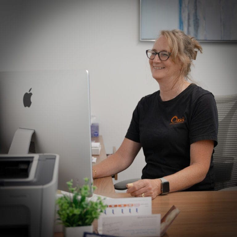 Team member working at her desk in the front office